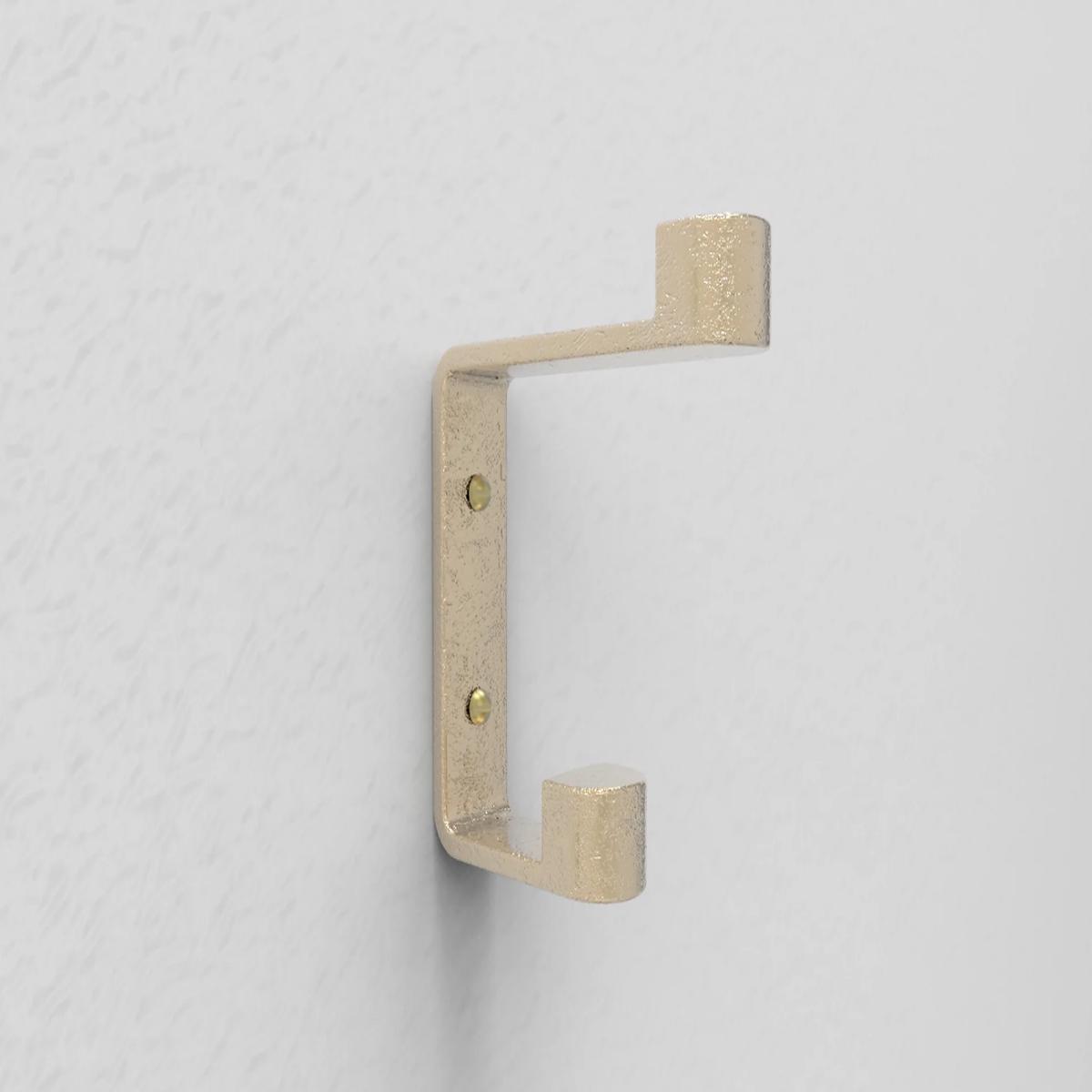 Ribbon Hook in Brass by Henry Wilson